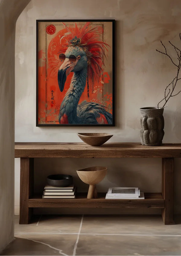 Aan een beige muur hangt een ingelijst kunstwerk met een kleurrijke vogel die een zonnebril draagt en een hoofddeksel met rode veren. Daaronder, op de houten consoletafel, staan decoratieve voorwerpen zoals kommen, gestapelde boeken en een getextureerde vaas met droge takken, wat zorgt voor een opvallende CollageDepot aab 201 AI-display.,Zwart